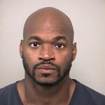 Ex-NFL star Adrian Peterson stares down the lens in new mugshot from his latest DWI arrest