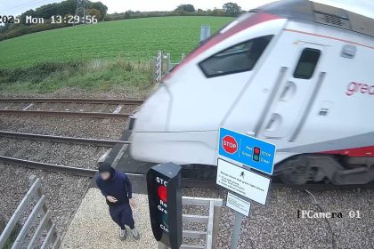 Shocking CCTV shows reckless teenager ‘playing chicken’ at level crossing