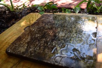 Ancient Roman tombstone found beneath undergrowth in New Orleans yard