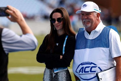 Jordon Hudson Poses for Photos on Sidelines at Bill Belichick’s UNC Game