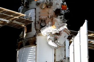 Spacewalking Russian cosmonauts install experiments on the International Space Station
