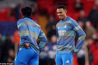 Liverpool fans BOO Trent Alexander-Arnold as Real Madrid star warms up on Anfield return – but ex-Reds defender grins through the jeers