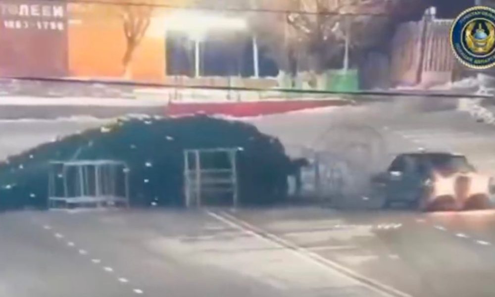 Moment speeding Lada knocks down town’s Christmas tree in Borat-land stunt fail