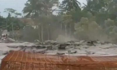 Mount Semeru erupts sending ash 3,900ft into air as flowing mud devastates towns