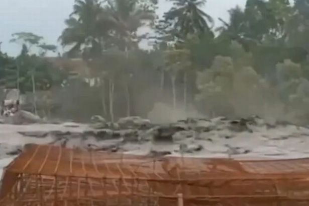 Mount Semeru erupts sending ash 3,900ft into air as flowing mud devastates towns