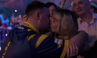 A good luck kiss! Luke Litter locks lips with his beautician girlfriend as teenage darts sensation begins World Championship defence
