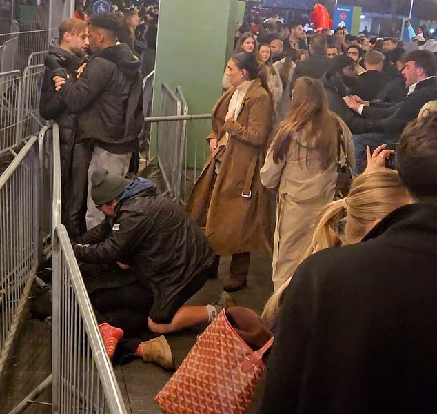 Winter Wonderland explodes into violence as woman is punched unconscious by man in mass brawl as over-crowded parkgoers blame security