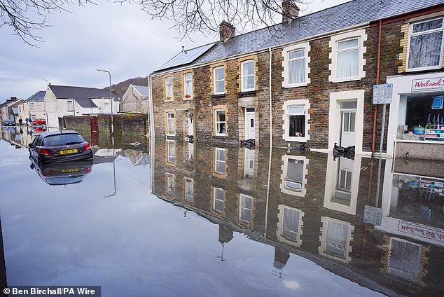 Flood and ‘do not travel’ alerts issued after half a month’s rain falls in just 24 hours – with more yellow and amber warnings in place