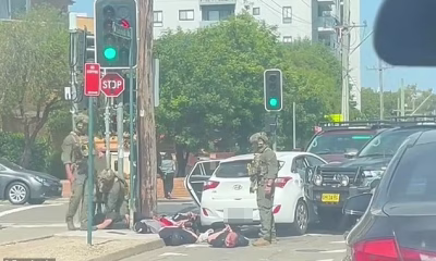 Dramatic moment heavily-armed police in camouflage swarm a group of men travelling to Bondi Beach as part of mystery counter-terrorism operation