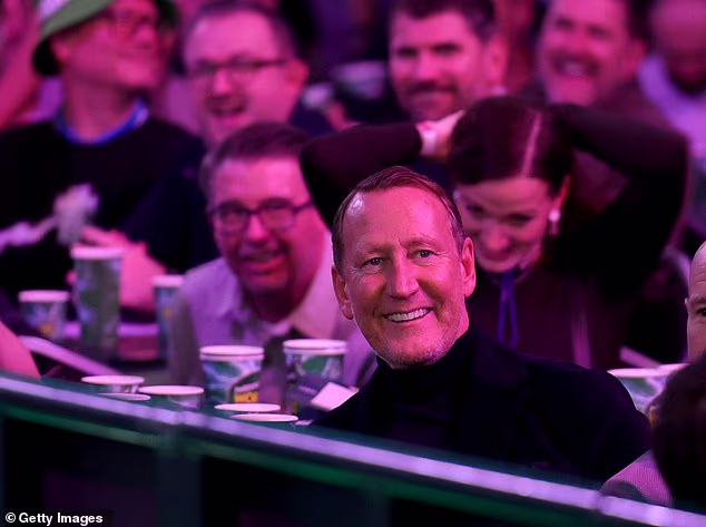 Former Arsenal star downs a pint at the darts after being mocked for being ‘boring’ by Ally Pally crowd