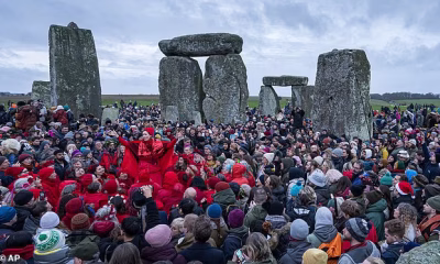 Thousands gather at Stonehenge to celebrate winter solstice: Crowds gather at historic monument for sunrise on shortest day of the year