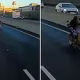 Heart-stopping moment reckless biker speeds down A-road in a ‘Superman’ pose