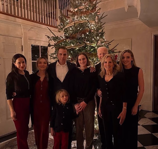 Joe Biden posts confusing Christmas card of his whole family…but fans say they can BARELY see him