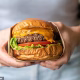 Eat a burger a week to help save the planet, scientists say in ‘vegan-annoying announcement’- because ‘some meat is environmentally good’