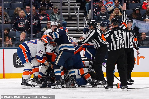 Hockey star attacks rival with his STICK and sparks huge brawl in wild midgame meltdown