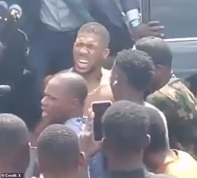 Anthony Joshua ‘is stable’, officials confirm after he was pulled from crumpled wreckage of car crash in Nigeria that killed two ‘foreign nationals’ in the same vehicle as him