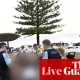 Bondi beach shooting live updates: two people in custody as PM urges public to follow police guidance amid ‘shocking and distressing’ scenes | New South Wales