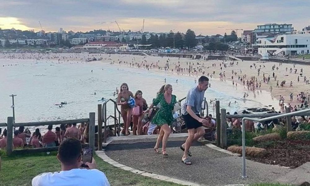Moment hundreds on Bondi Beach run for their lives in terror as gunmen open fire