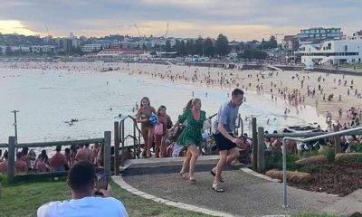 Moment hundreds on Bondi Beach run for their lives in terror as gunmen open fire