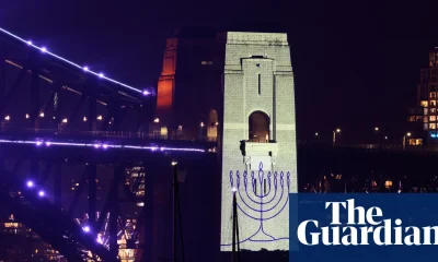 Sydney New Year’s Eve strikes sombre tone as fireworks follow minute’s silence for Bondi | Australia news