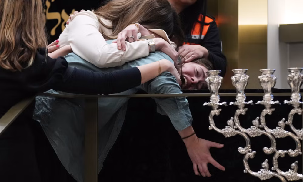 Bondi Beach suspect charged with 15 counts of murder as first funerals take place in Sydney