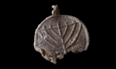 Rare 1,300-year-old medallion decorated with menorahs found near Jerusalem’s Temple Mount