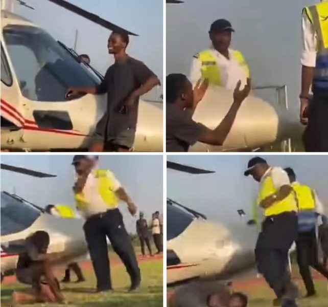 Officer Caught On Camera Ass@ulting Young Man For Posing Beside Helicopter That Flew Singer Asake To OAU (Video)