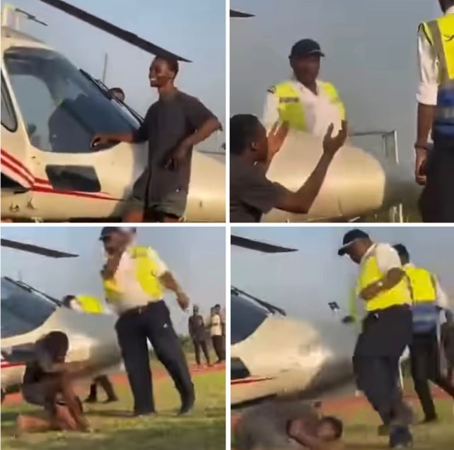 Officer Caught On Camera Ass@ulting Young Man For Posing Beside Helicopter That Flew Singer Asake To OAU (Video)