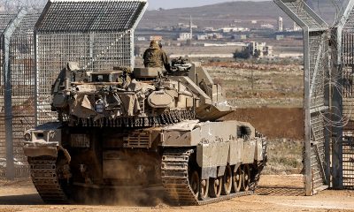 Syria soldiers chant anti-Israel slogans as minister warns ‘war inevitable’