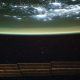 ISS astronauts watch Earth’s atmosphere glow green photo of the day for Dec. 8, 2025
