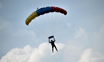 Skydiver’s reserve chute mistakenly deploys, leaving him dangling from plane